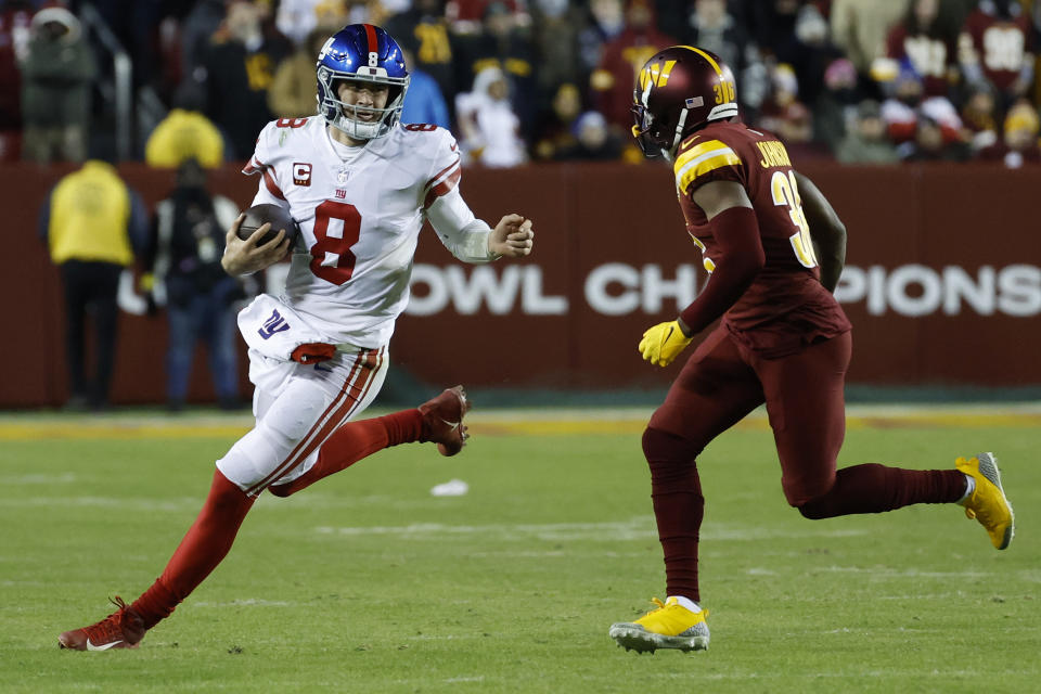 New York Giants quarterback Daniel Jones (8) runs with the ball as Washington Commanders cornerback Danny Johnson (36). Mandatory Credit: Geoff Burke-USA TODAY Sports