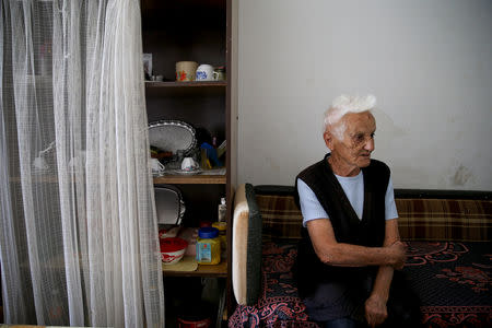 Bosnian Serb Sofija Vidovic, an internally displaced person from Zenica, sits in her room at a reception center where IDPs live, in Kladari Donji, near Modrica, Bosnia and Herzegovina, October 1, 2018. REUTERS/Dado Ruvic