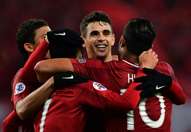 SIPG bought Oscar (centre) from Chelsea for an Asian-record 60 million euros and also boast his fellow Brazilian international Hulk (right)