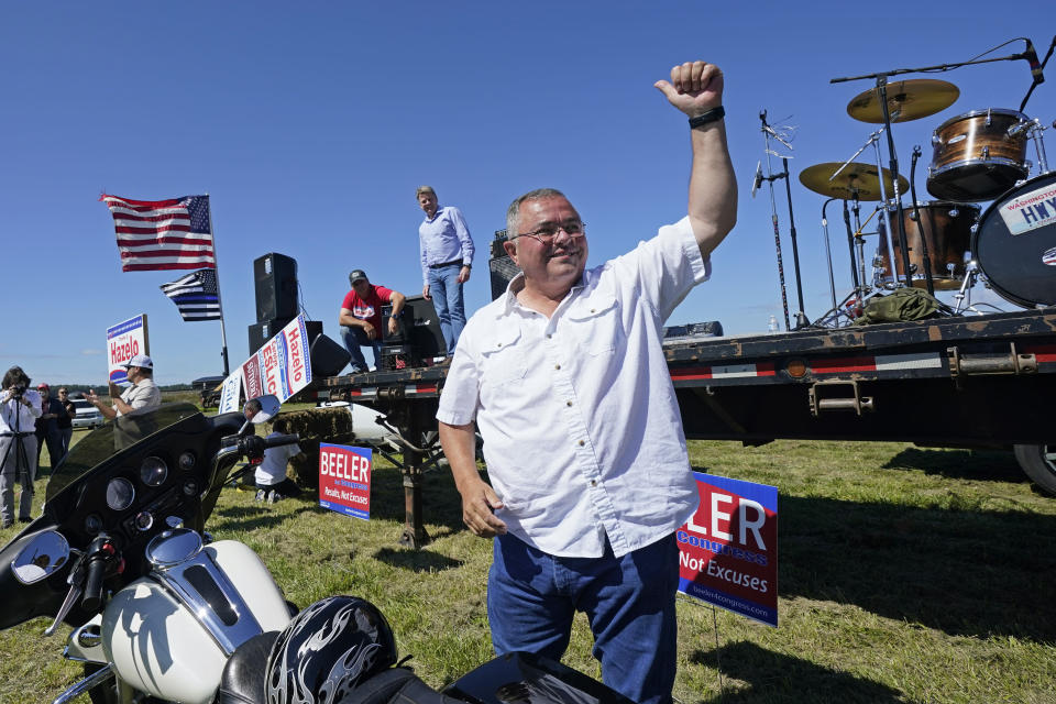 FILE - Republican gubernatorial candidate Loren Culp smiles while greeting supporters as he arrives at a rally Aug. 29, 2020, in Mount Vernon, Wash. Republican Rep. Dan Newhouse, who voted to impeach Donald Trump over the Jan. 6 insurrection, appeared well positioned Friday, Aug. 5, 2022, to advance to the general election in his Washington state primary. Newhouse, the four-term incumbent in the 4th Congressional District in central Washington, had about 26% of the vote. Culp, a Trump-endorsed former small town police chief who lost the 2020 governor’s race to Democrat Jay Inslee, was at about 21 21%. (AP Photo/Elaine Thompson, File)