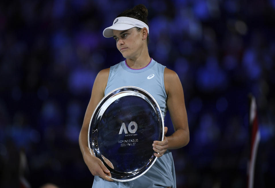 FILE - United States' Jennifer Brady holds her runners-up trophy after she lost to Japan's Naomi Osaka in the women's singles final at the Australian Open tennis championship in Melbourne, Australia, Feb. 20, 2021. Brady is one of several players who recently returned to the tennis tour after time away, helping make this the year of comebacks at the 2023 U.S. Open, which was scheduled to begin in New York on Monday, Aug, 28, 2023. (AP Photo/Andy Brownbill, File)