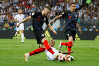 <p>Last-ditch defending: Ashley Young gets his toe to the ball to prevent Ante Rebic shooting in a dangerous position </p>