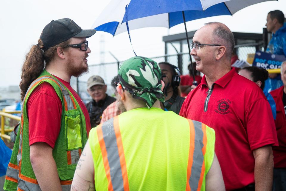 UAW president Shawn Fain talks to Ford workers outside of Ford's Michigan Assembly Plant in Wayne on Wednesday, July 12, 2023.