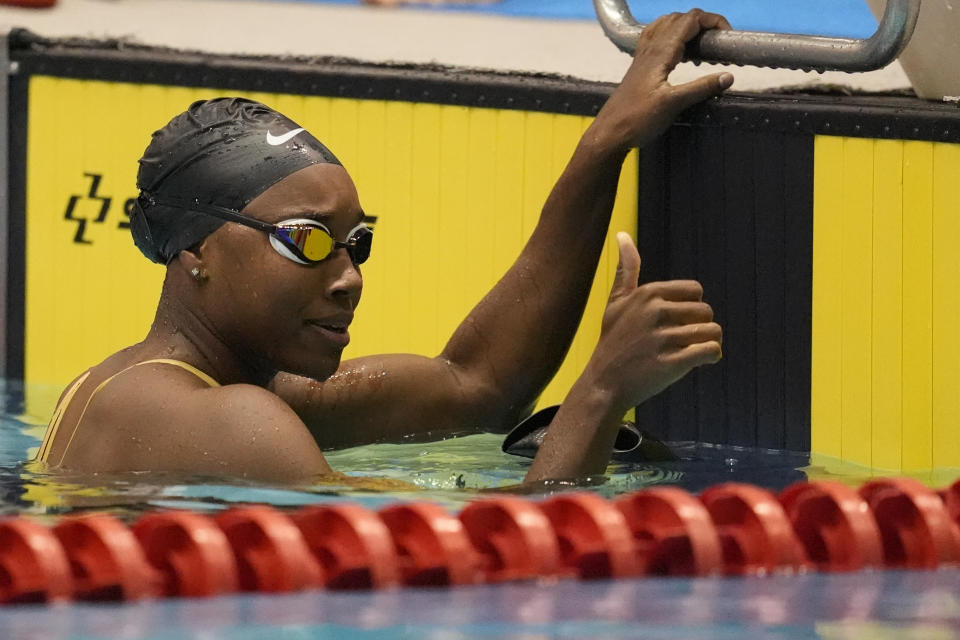 Simone Manuel gives a thumbs up after competing at the Pro Swim Series event Thursday, Jan. 11, 2024, in Knoxville, Tenn. Manuel was the first Black female swimmer to capture an Olympic gold medal. Now she's coming back from a debilitating case of overtraining syndrome, her body breaking down in the leadup to the 2021 Tokyo Games. (AP Photo/George Walker IV)