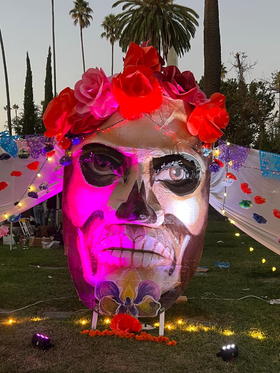 A giant skull presides over the Día de Los Muertos celebration at the Hollywood Forever Cemetery in Los Angeles on Saturday, Oct. 28, 2023.
