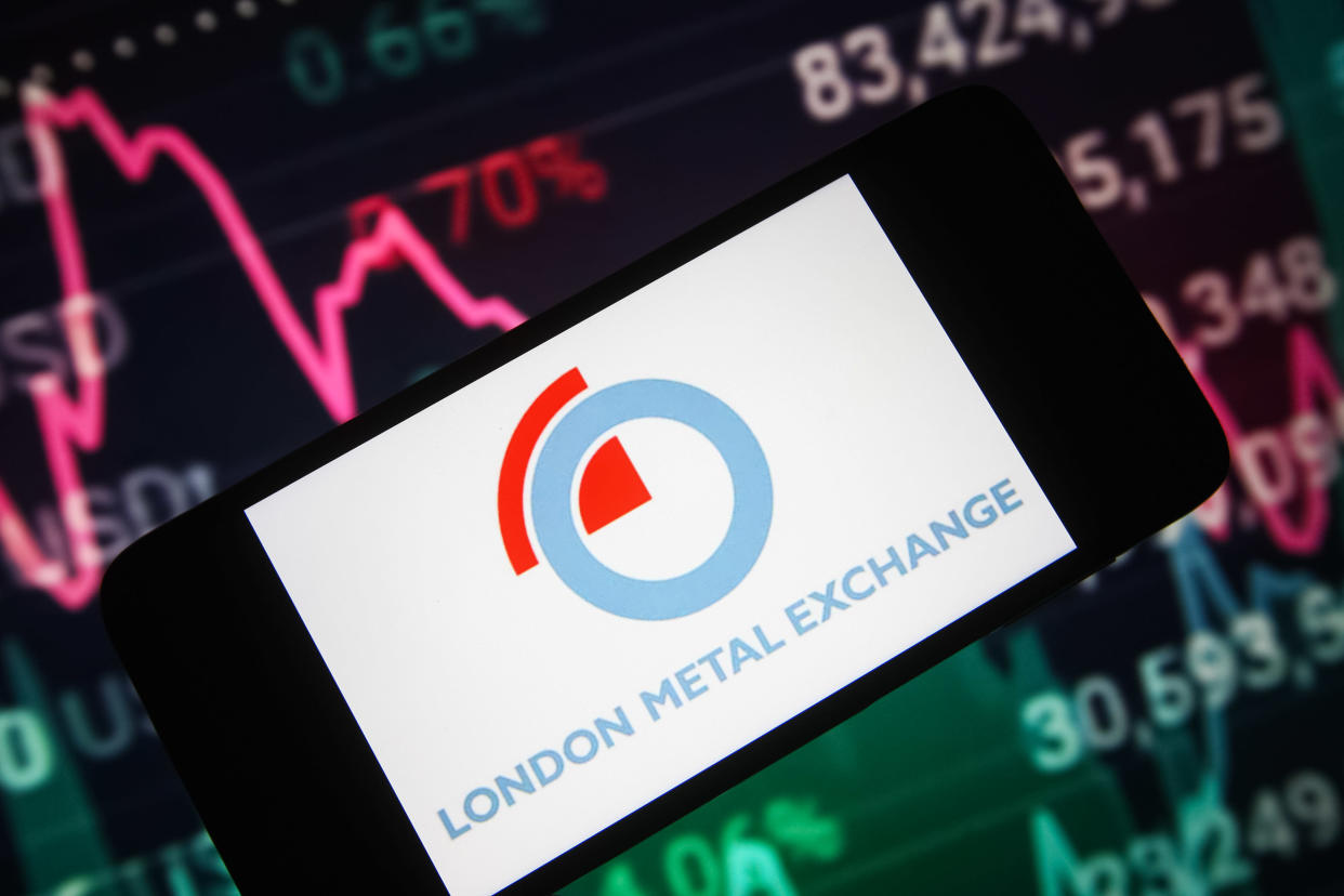 UKRAINE - 2022/01/11: In this photo illustration, the London Metal Exchange (LME) logo is seen on a smartphone screen and a stock market information in the background. (Photo Illustration by Pavlo Gonchar/SOPA Images/LightRocket via Getty Images)