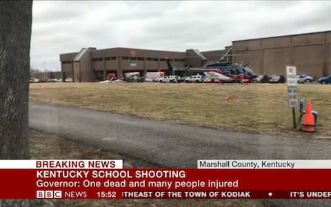A suspect was taken into custody after one person was killed and others wounded Tuesday morning at a rural Kentucky high school - Credit: BBC News 