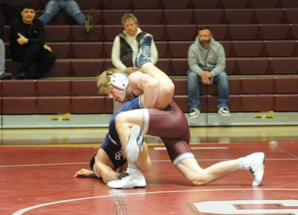 State College’s Asher Cunningham controls Cedar Cliff’s Erik Schiver in their 160-pound bout of the Little Lions’ 34-32 win on Thursday at State College. Cunningham pinned Schiver in 1:02.