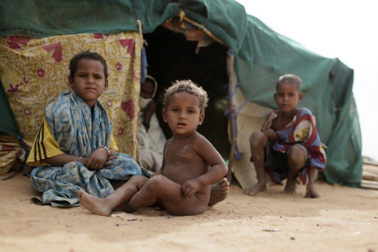 Malian refugees children at a refugee camp in Menteao near the Malian border on January 24, 2013. French warplanes destroyed two Islamist bases in northern Mali as a leading Al Qaeda-linked group in the region split Thursday, with the breakaway group saying it wanted talks to end a Paris-led offensive against the militants