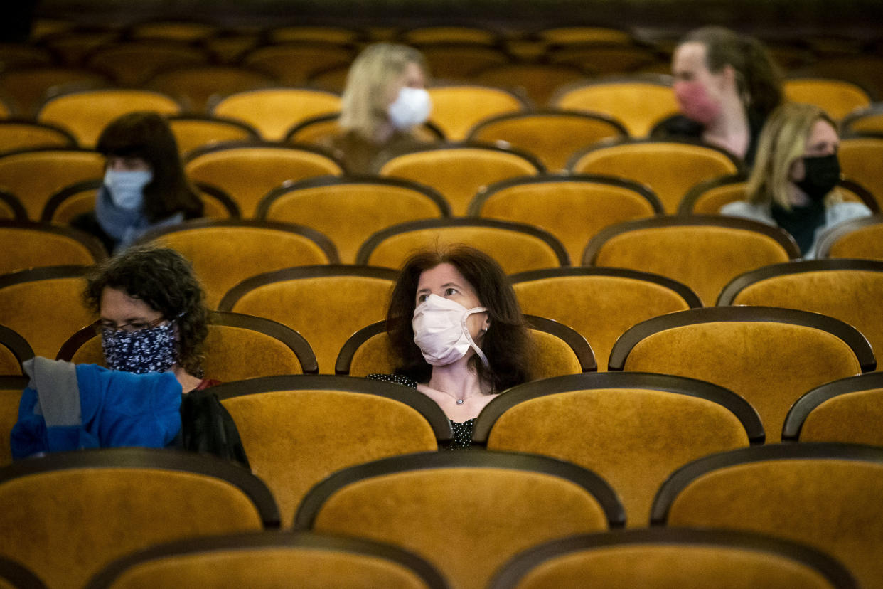 PRAGUE, CZECH REPUBLIC - MAY 11: Customers wearing protective masks sit apart in observance of social distancing measures inside a movie theater as the Czech government lifted more restrictions allowing cinemas to re-open on May 11, 2020, in Prague, Czech Republic. The Czech government has begun further easing the restrictive measures to slow down the spread of the pandemic COVID-19 disease during the lockdown. (Photo by Gabriel Kuchta/Getty Images)