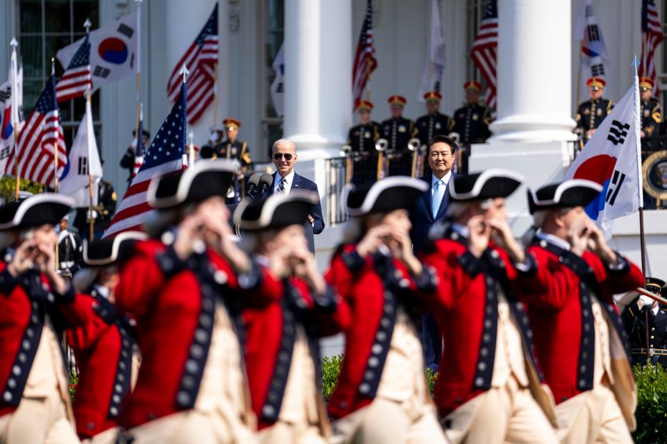 A drum and fife corps performs for President Joe Biden and South Korean President Yoon Suk Yeol during an arrival ceremony on the White House South Lawn.