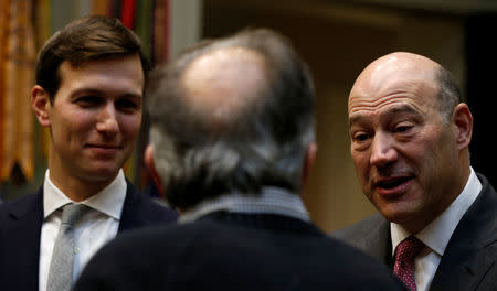 FILE PHOTO: President Donald Trump's senior advisor Jared Kushner (L) and the head of the National Economic Council Gary Cohn, talk with Fiat Chrysler CEO Sergio Marchionne (C) during Trump's meeting with U.S. auto industry CEOs at the White House, January 24, 2017. REUTERS/Kevin Lamarque