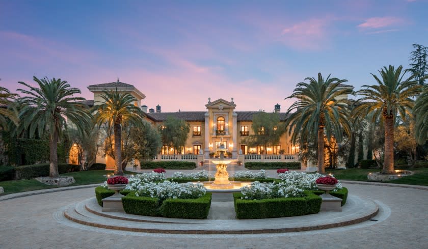 Built in 1998, the estate combines three lots across nearly 10 acres and centers on an Italian-inspired mansion.