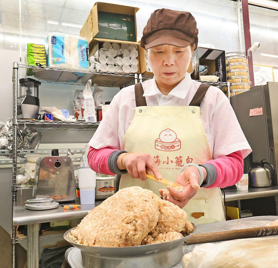 Conny Yao makes dumplings by hand at Shanghai Soup Dumplings in the Kam Man Shopping Center on Quincy Avenue in Quincy on Monday, April 15, 2024.