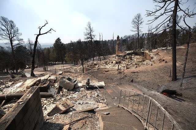 <p>Omar Ornelas/Anadolu via Getty Images</p> Structures that were destroyed in the Village of Ruidoso, New Mexico are photographed on June 19, 2024