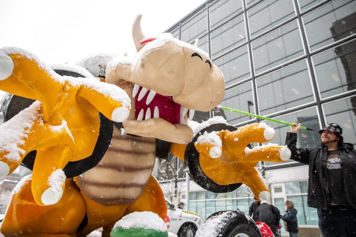 Cosplayers and fans brave the snow, despite the cancellation of the 8th Annual Parade of Wonders in Calgary on April 22, 2022. The parade marks the official start of the Calgary Comic and Entertainment Expo.  (Oseremen Irete/CBC - image credit)