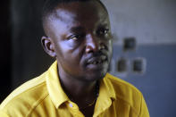 Nicholas Okpe, a commercial bus driver, who says he was shot during last year's police brutality protests, speaks with The Associated Press in Lagos, Nigeria, Oct. 14, 2021. He is among more than 100 Nigerians awaiting a verdict from a panel that is reviewing both the Lekki shooting and allegations of police brutality that inspired the October 2020 protests. (AP Photo/Sunday Alamba)