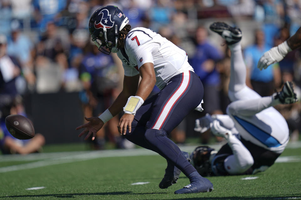 Houston Texans quarterback C.J. Stroud (7) chases a fumble against the Carolina Panthers during the first half of an NFL football game, Sunday, Oct. 29, 2023, in Charlotte, N.C. (AP Photo/Erik Verduzco)