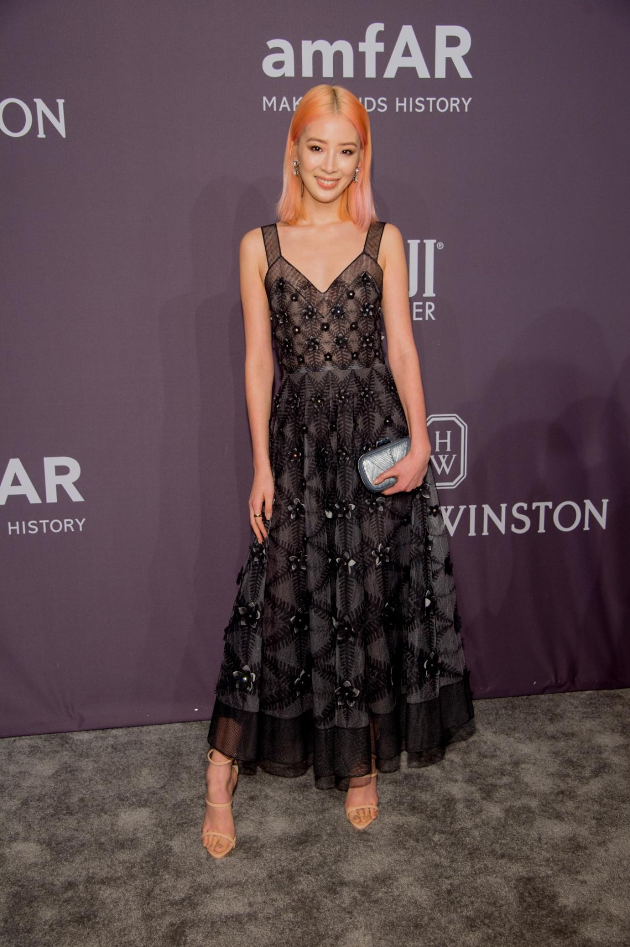 The black lace might look a little gothic, but is balanced well with Kim’s soft pink hair (Photo: Getty/Kevin Tachman)