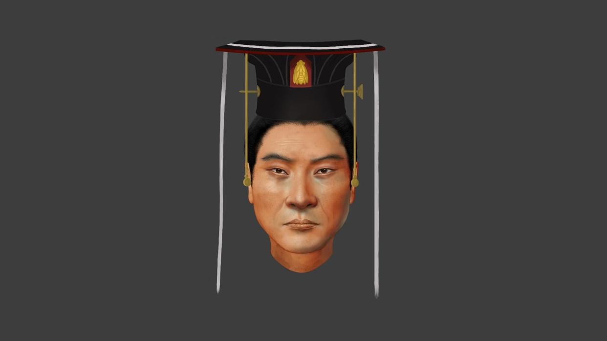 the facial reconstruction of Emperor Wu, an ancient Chinese ruler of the Northern Zhou dynasty. he has dark hair, tan skin.