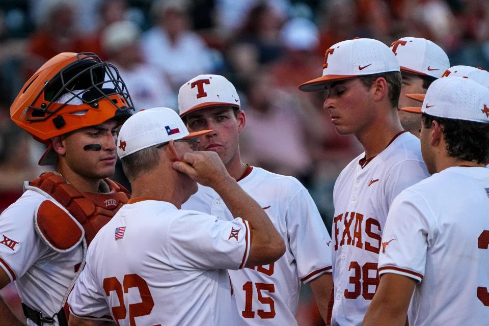 Texas Longhorns head coach David Pierce talks to pitcher Max Grubbs on the mound during the game against Kansas at UFCU Disch–Falk Field on May 17. Pierce now has to look to the offseason and a future in the SEC next year.