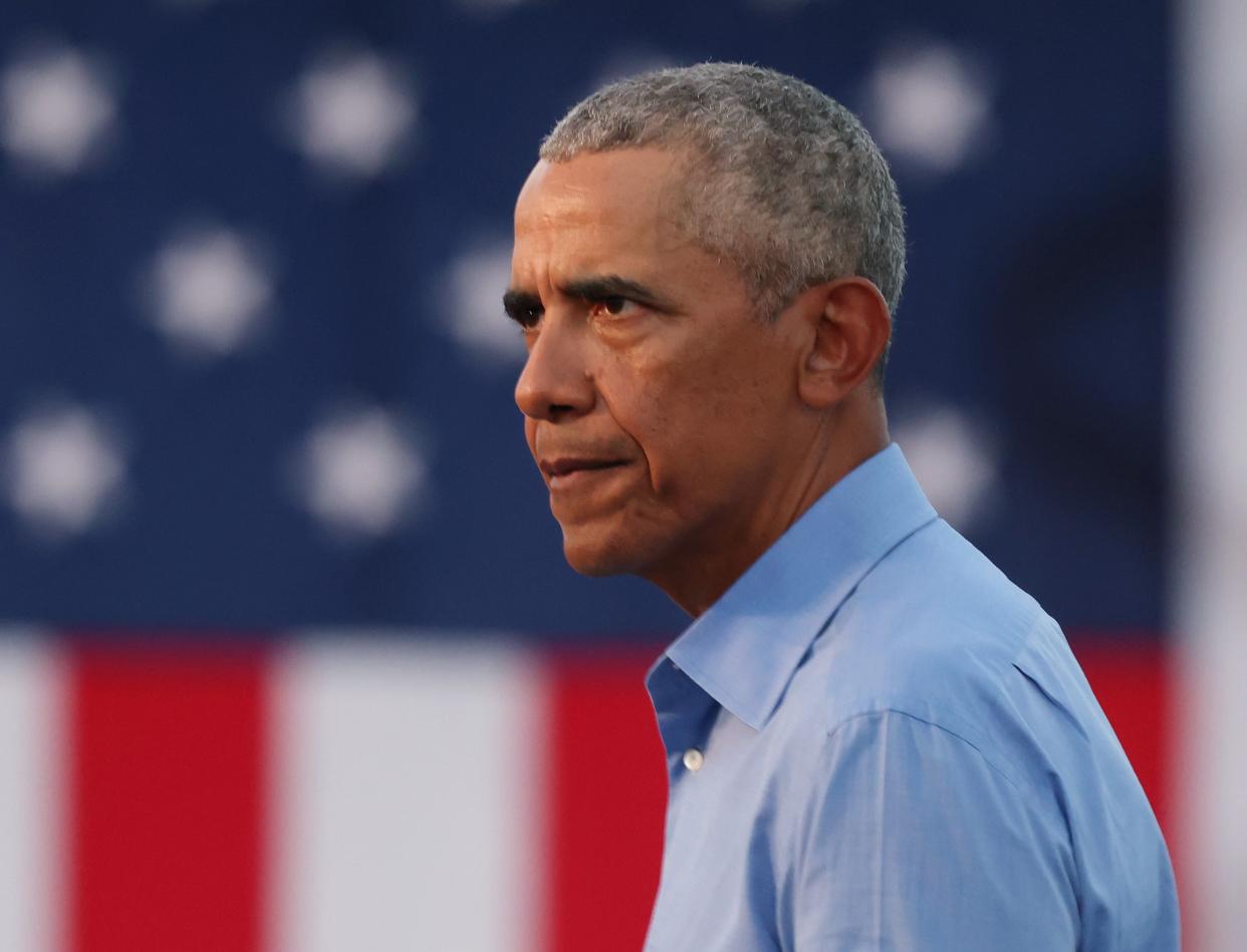 <p>Former President Barack Obama speaks during a drive-in rally while campaigning for Democratic nominee Joseph Biden, on October 21, 2020 in Philadelphia, Pennsylvania. </p> (Photo by Michael M. Santiago/Getty Images))