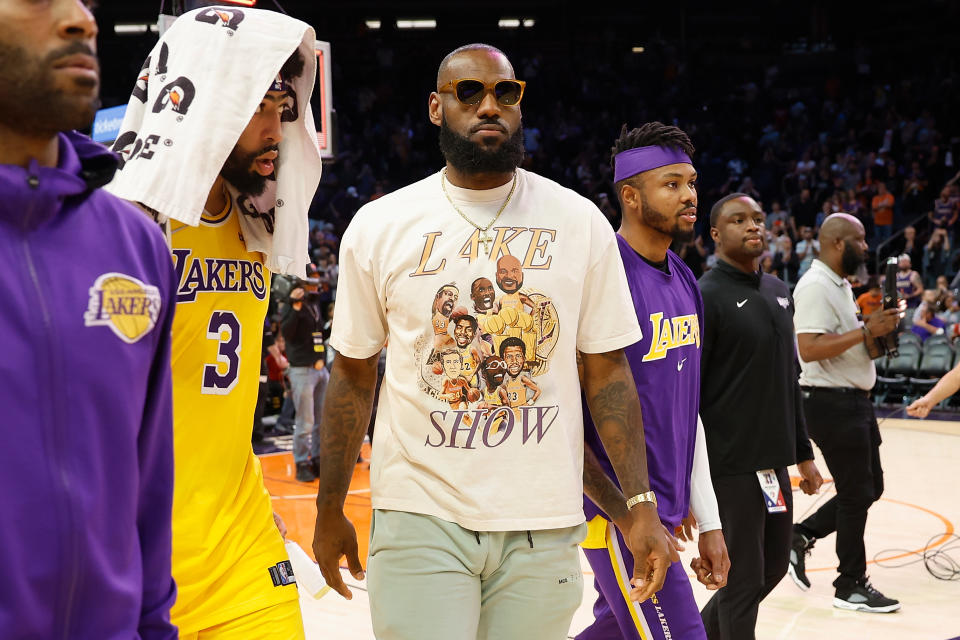 PHOENIX, ARIZONA - APRIL 05: LeBron James #6 and Anthony Davis #3 of the Los Angeles Lakers walk off the court following the NBA game at Footprint Center on April 05, 2022 in Phoenix, Arizona.  The Suns defeated the Lakers 121-110. NOTE TO USER: User expressly acknowledges and agrees that, by downloading and or using this photograph, User is consenting to the terms and conditions of the Getty Images License Agreement. (Photo by Christian Petersen/Getty Images)