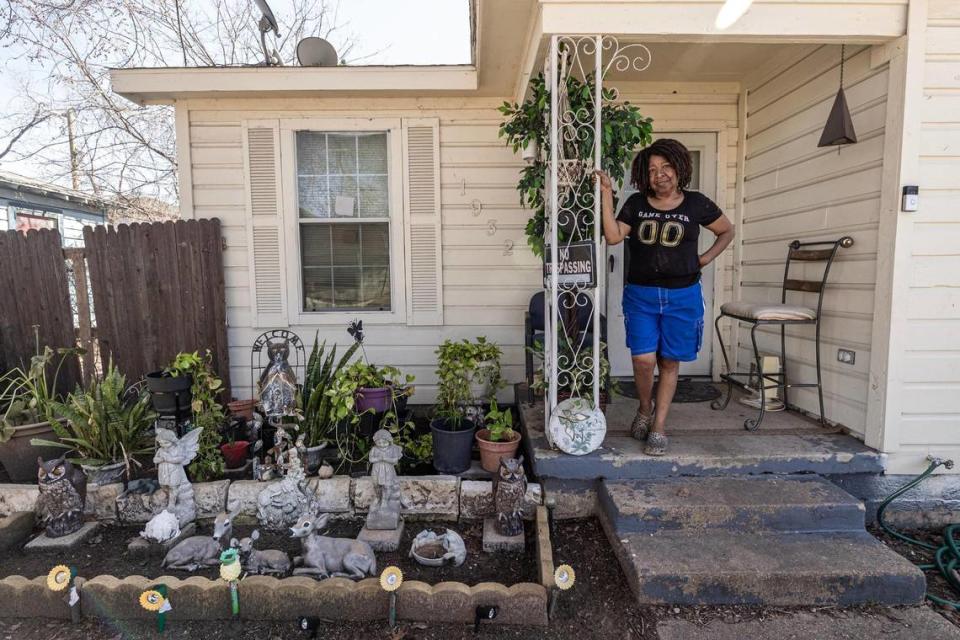 Greenway resident Charlotte Peoples stands for a portrait on the porch of her late brother’s house on Carver Avenue in Fort Worth on Wednesday, Feb. 21, 2024. Peoples, 64, has lived in Greenway since the 1960’s and remembers it as a neighborhood where everyone knew each other. Now, Greenway is getting increased attention from home builders looking to purchase land close to downtown which increases property taxes for residents who might not be able to afford the hefty prices.