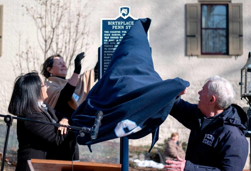 Penn State President Neeli Bendapudi, Mary Sorensen and Roger Williams unveil the new campus historical marker, “Birthplace of Penn State,” Thursday on the grounds of the Centre Furnace Mansion.