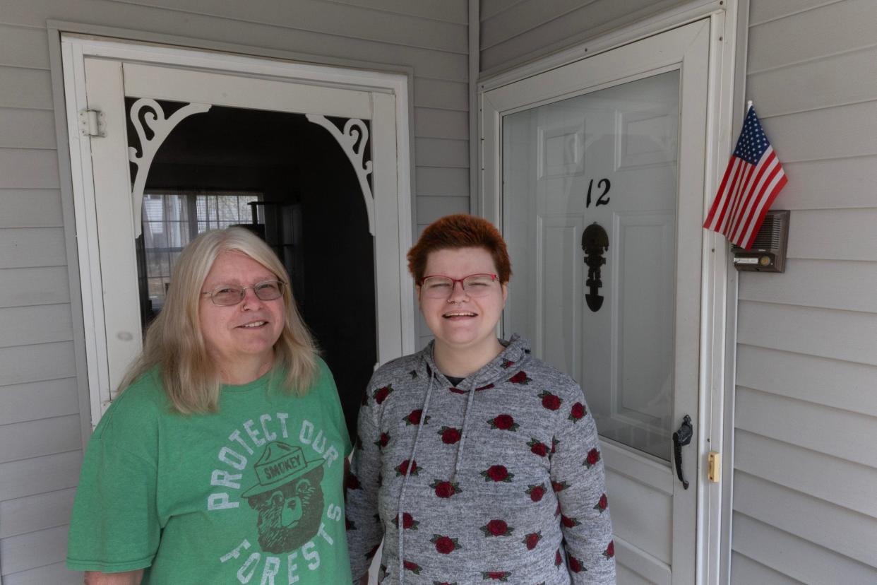 Patricia Kelly and her daughter Jessica outside of their new townhouse in Marlboro. Through a new mortgage program from OceanFirst Bank, Jessica now lives in a home where she has her own bedroom.