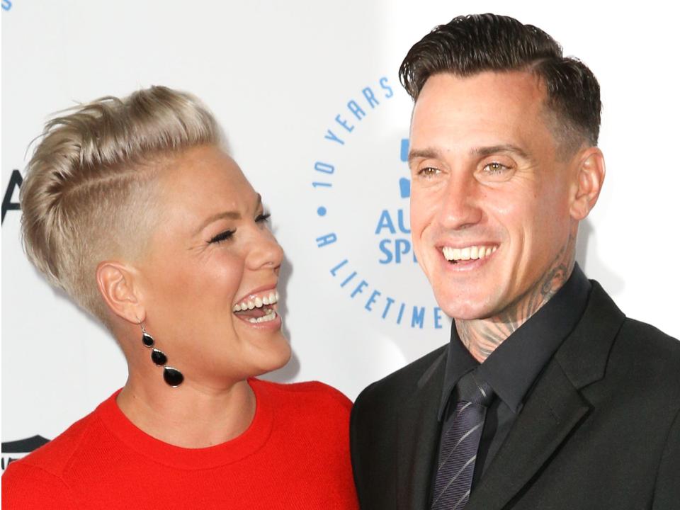 Singer Pink smiles at husband Carey Hart.