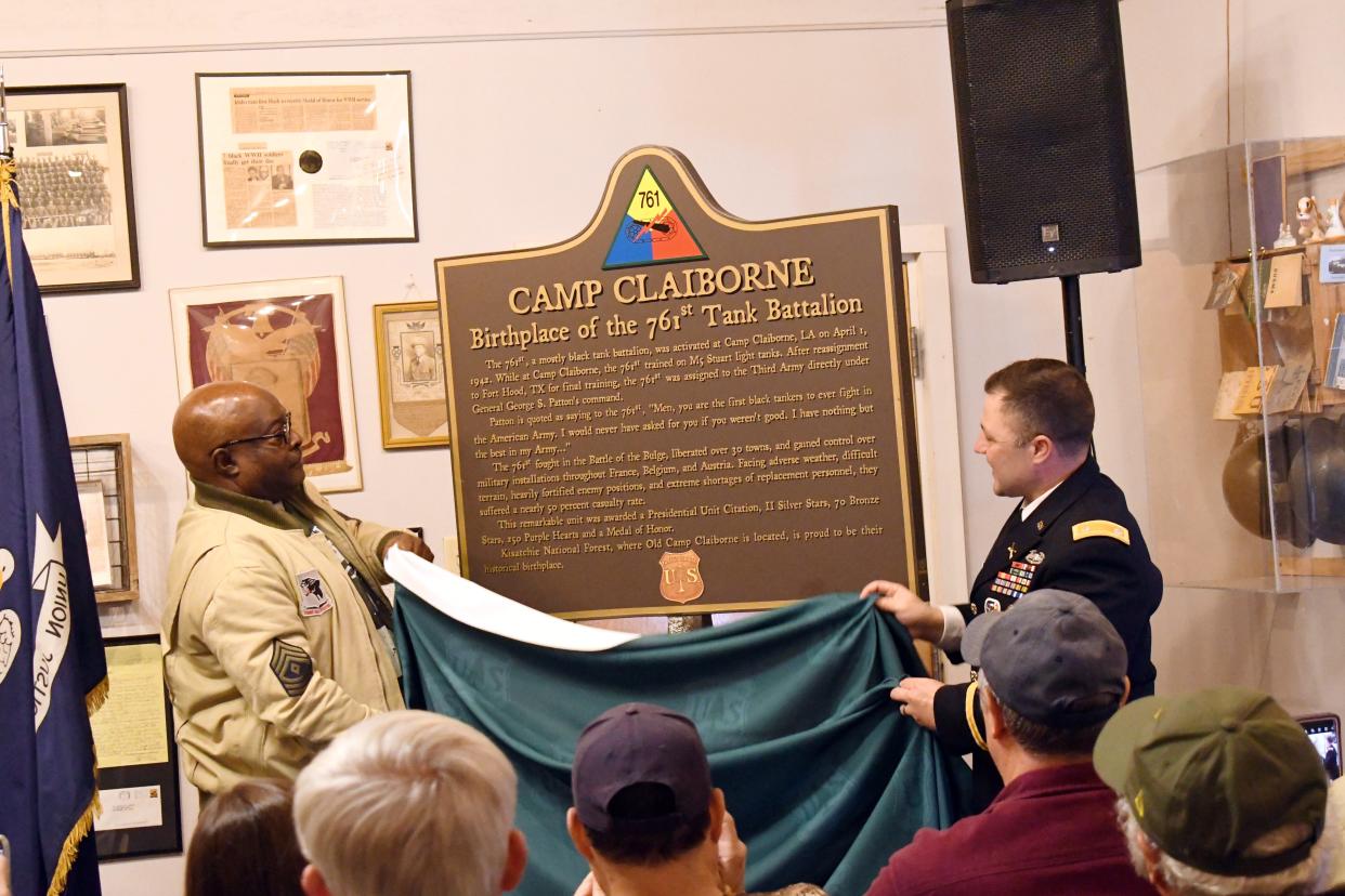 Clinton Warren (left) and Lt. Col. Jon Chavous of Fort Polk unveil a historical marker commemorating the 761st Tank Battalion, known as the Black Panthers, during a ceremony Thursday, Feb. 2, 2023. The 761st was activated at the former Camp Claiborne in 1942.