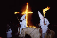 <p>The presence of Ku Klux Klan knights is a rare thing during cross burnings, in 1990. (Photo: Eric-Paul-Pierre PASQUIER/Gamma-Rapho via Getty Images) </p>