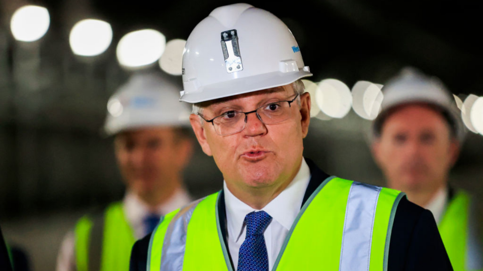 Prime Minister Scott Morrison wearing a reflecting vest and hard hat.