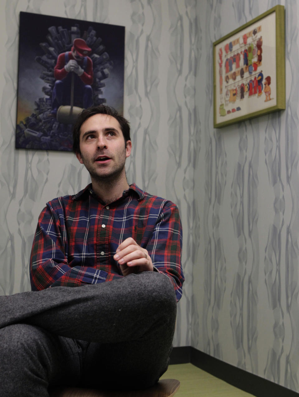 Then-Twitch CEO Emmett Shear is seen in a conference room dedicated to the Mario Brothers video game series at the company's headquarters in San Francisco on Dec. 6, 2013. OpenAI is bringing in the former head of Twitch as interim CEO just days after the company pushed out its well-known leader Sam Altman, sparking upheaval in the AI world. Emmett Shear announced his new role Monday, Nov. 20, 2023, in a post on X. (Paul Chinn/San Franicsco Chronicle via AP)