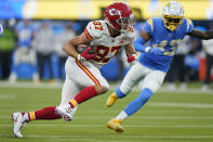 Kansas City Chiefs tight end Travis Kelce runs on his way to scoring a touchdown during overtime in an NFL football game against the Los Angeles Chargers, Thursday, Dec. 16, 2021, in Inglewood, Calif. (AP Photo/Marcio Jose Sanchez)