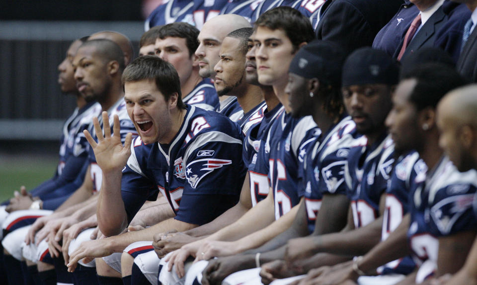 FILE - New England Patriots quarterback Tom Brady waves during the team's picture at the walk through at University of Phoenix Stadium on Feb. 2, 2008 in Glendale, Ariz. Brady, the seven-time Super Bowl winner with New England and Tampa Bay, announced his retirement from the NFL on Wednesday, Feb. 1, 2023 exactly one year after first saying his playing days were over, by posting a brief video lasting just under one minute on social media. (AP Photo/Stephan Savoia, file)