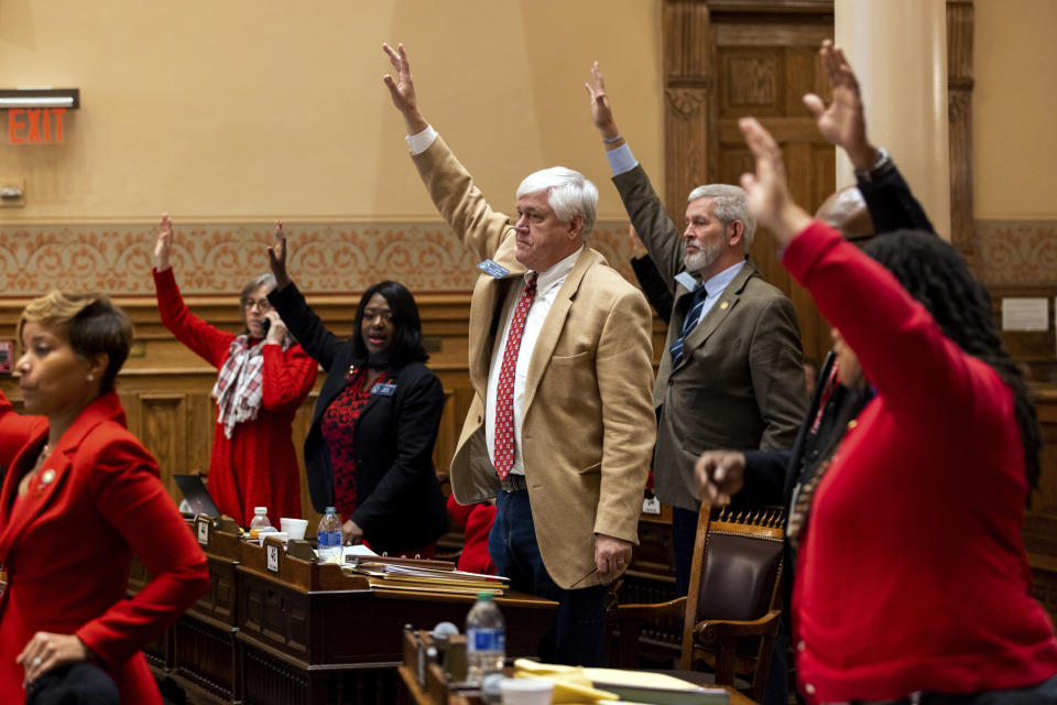 State senators take a hand vote regarding an amendment to sports betting Senate Bill 386 in the Senate at the Capitol in Atlanta, on Thursday, Feb. 1, 2024. (Arvin Temkar/Atlanta Journal-Constitution via AP)