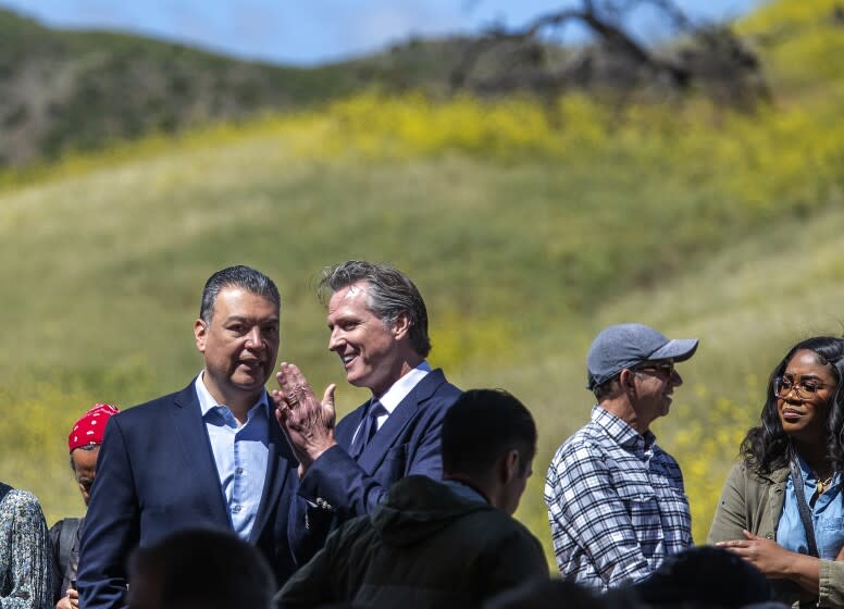 AGOURA HILLS, CA-APRIL 22, 2022: U.S. Senator Alex Padilla, left, and Governor Gavin Newsom attend the Wallis Annenberg Wildlife Crossing Groundbreaking Ceremony, held near the location of the future wildlife crossing in Agoura Hills. Spanning over ten lanes of the 101 freeway, when complete, the crossing will be the largest in the world, the first of its kind in California and a global model for urban wildlife conservation. (Mel Melcon / Los Angeles Times)