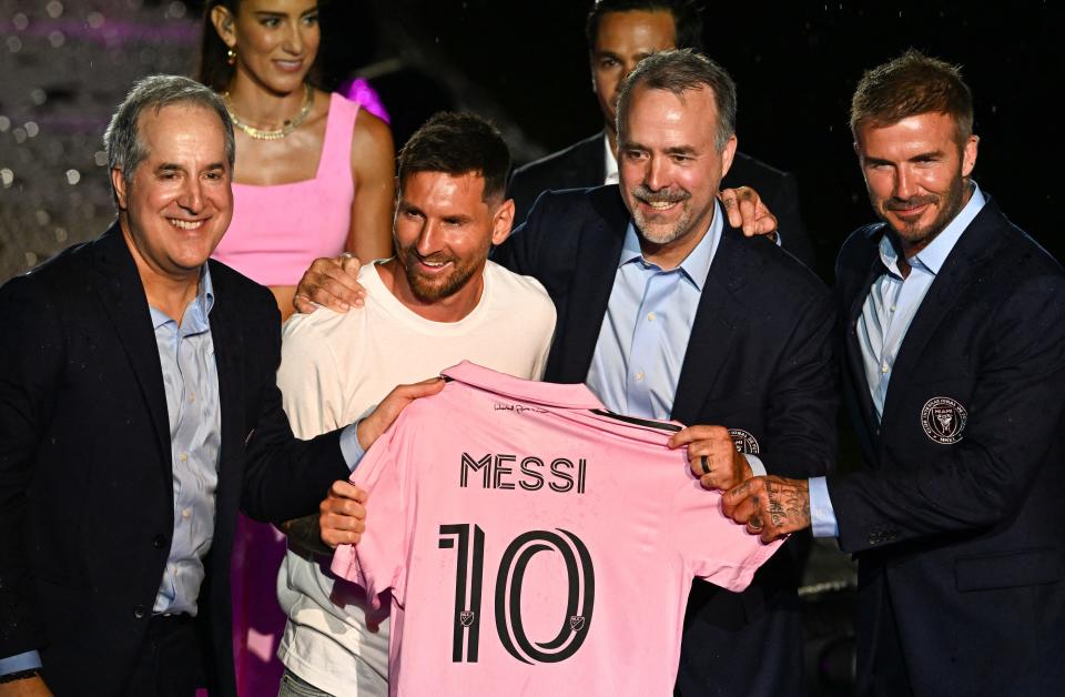 Lionel Messi is presented his new jersey by owners of Inter Miami CF David Beckham, Jose R. Mas and Jorge Mas.