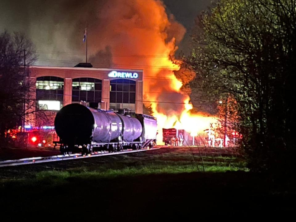 The train eventually halted at Pall Mall Street and Waterloo Street in central London, Ont. where it took 28 firefighters to knock down the blaze.  (Sean Davidson/CBC - image credit)