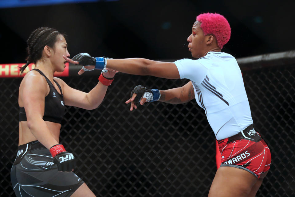 Jun 12, 2022; Singapore, SIN; Ramona (red gloves) fights Jocelyn Edwards (blue gloves) during UFC 275 at Singapore Indoor Stadium. Mandatory Credit: Paul Miller-USA TODAY Sports