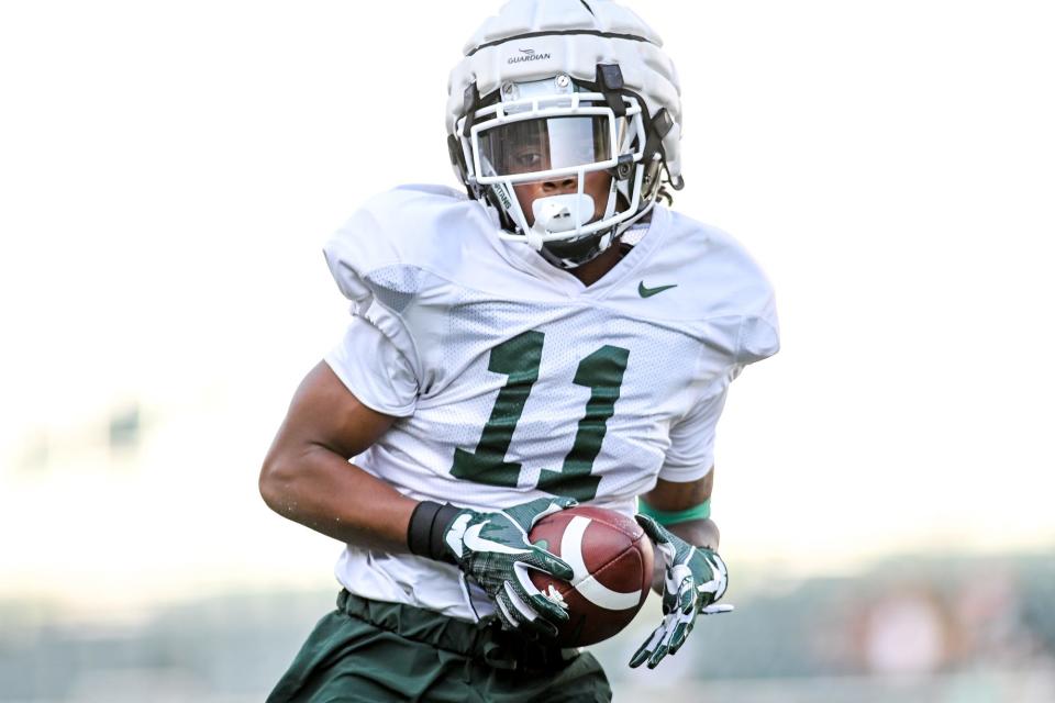Michigan State's Antoine Booth catches a ball during the Meet the Spartans open practice on Monday, Aug. 23, 2021, at Spartan Stadium in East Lansing.