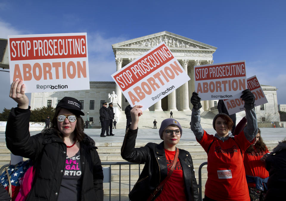 Abortion rights activists protest outside of the U.S. Supreme Court, during the March for Life in Washington Friday, Jan. 18, 2019. (AP Photo/Jose Luis Magana)