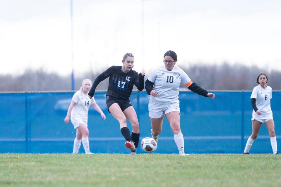 Harper Creek junior Alyssa Smith passes the ball during a game against Sturgis at Harper Creek High School on Thursday, April 5, 2024.