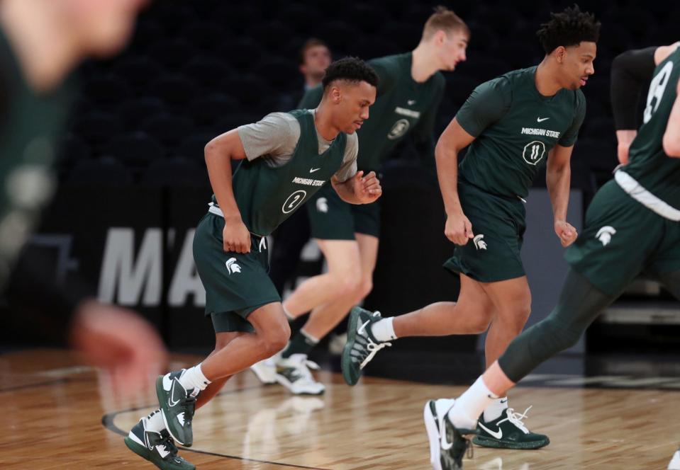 Michigan State guards Tyson Walker, left, and A.J. Hoggard run during practice on Wednesday, March 22, 2023, in preparation of the East Regional semifinal against Kansas State in the NCAA tournament.