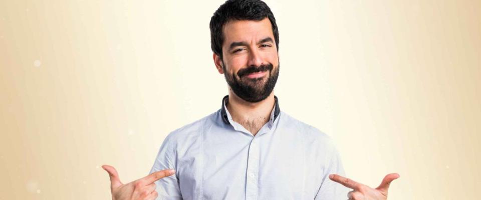 Man proud of himself over ocher background