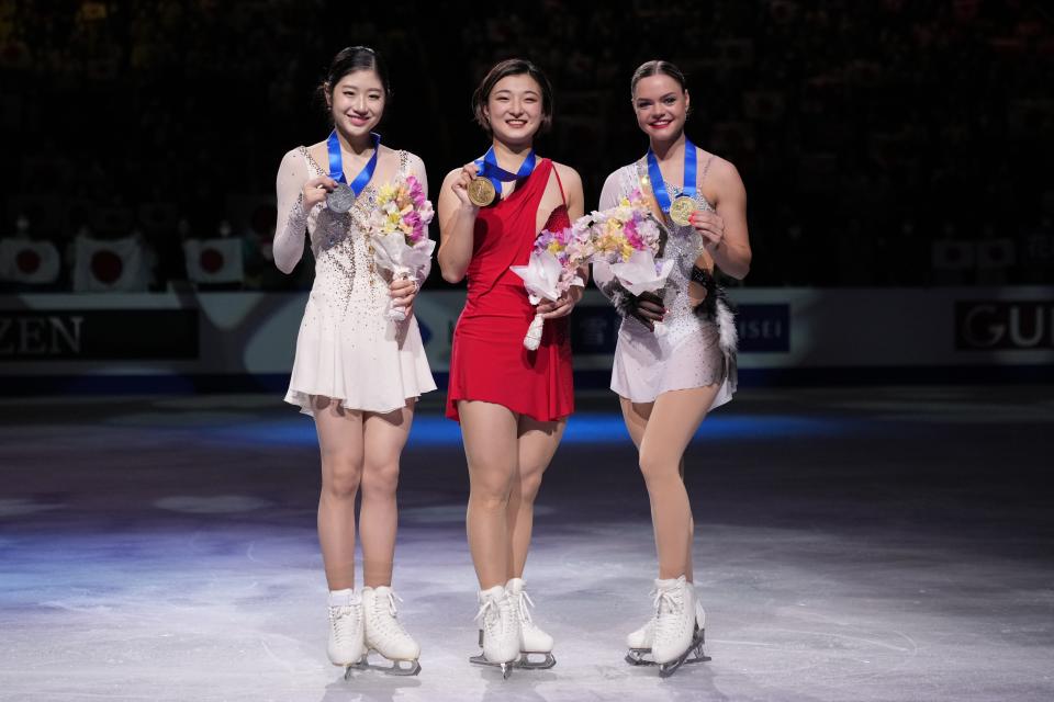 Kaori Sakamoto of Japan, center, with her gold medal, Lee Hae-in of South Korea, left, with her silver medal, and Loena Hendrickx of Belgium, with her bronze medal, pose for a photo during the award ceremony of the women's free skating program in the World Figure Skating Championships in Saitama, north of Tokyo, Friday, March 24, 2023. (AP Photo/Hiro Komae)