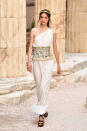 <p>A model in a Grecian-inspired white dress walks the runway during Chanel Cruise 2018 Collection at Grand Palais in Paris. (Photo: Getty Images) </p>