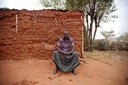 Yusuf Mume salleh, 70, known as the first Hyena Man, sits near his house within the walled city of Harar, Ethiopia, February 25, 2017. REUTERS/Tiksa Negeri